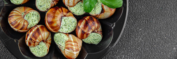 snails with green oil aromatic herbs tasty fresh healthy eating cooking appetizer meal food snack on the table copy space food background