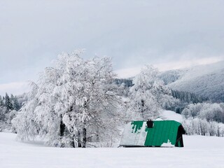 Lonely cabin in the mountains in winter