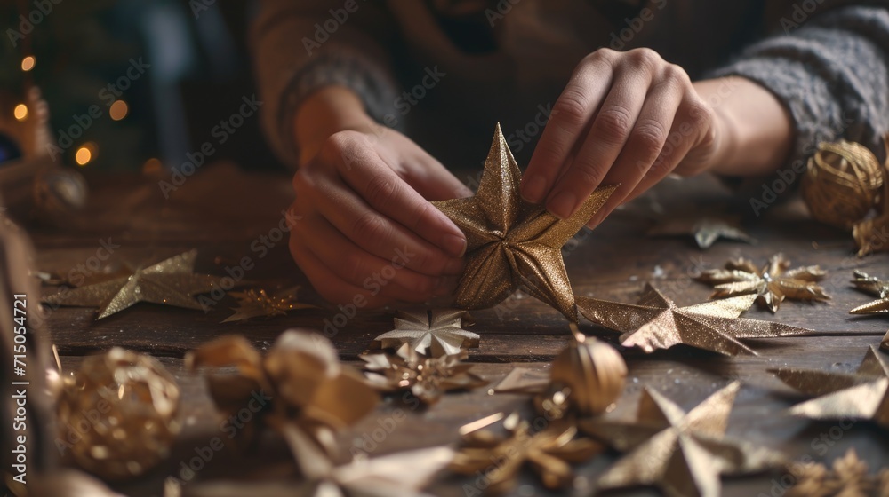 Poster a person creating a gold star decoration. this image can be used for various crafts and diy projects