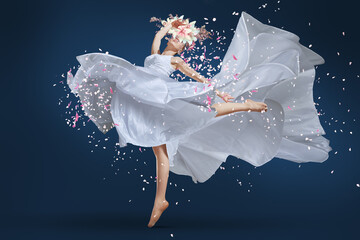 A ballet dancer leaping with grace, adorned in a long white dress and a delicate flower crown....