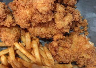 Fried chicken and french fries ready to eat