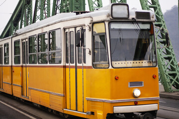 Naklejka premium yellow tram close-up, public transport