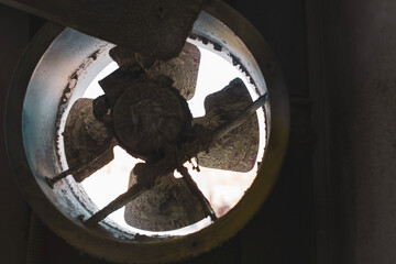 a very dirty fan impeller close-up, when used for a very long time in a car painting room