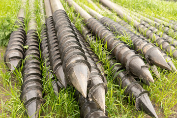 Screw piles for terrace foundations. Geo screws are steel round elements of an engineering...
