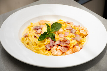 fettuchini pasta dish with shrimp and bacon italian food