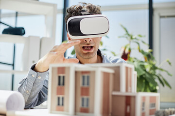 man sits in the office of a realtor and looks at the layout of the apartment in virtual reality...