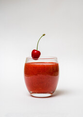 Glass with strawberry smoothie and on a white background. Summer drink. Vitamins, diet, proper nutrition, vegan