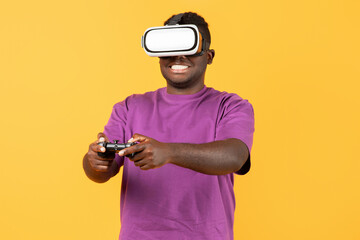 Portrait of black man wearing VR glasses using remote controller
