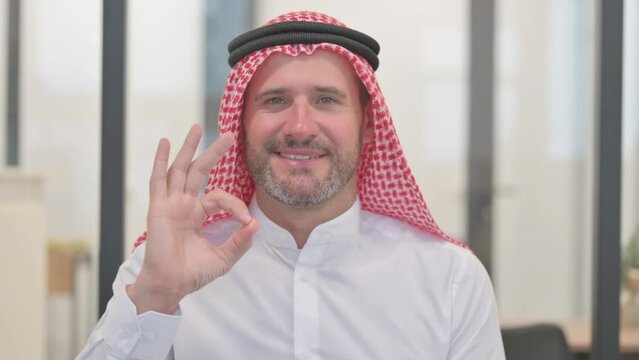 Portrait of Arab Man with Okay Sign
