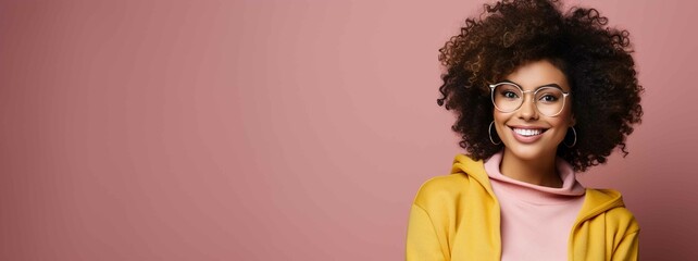 Cute afro woman looking at camera with glasses and curly hair, banner with copy space
