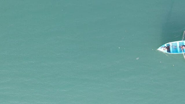 Dominican men fishing seen from drone