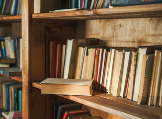 Old, Nameless Book For Sale In Brown Wooden Library, With Blurred Background Adding Timeless And Classical Touch To Scene. Concept Of Knowledge Acquisition And Charm Of Vintage Literature. . High