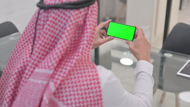 Arab Man Holding Phone with Green Screen