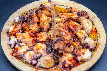 Traditional dish of octopus a feira or Galician style. Selective focus. Galicia, Spain.
