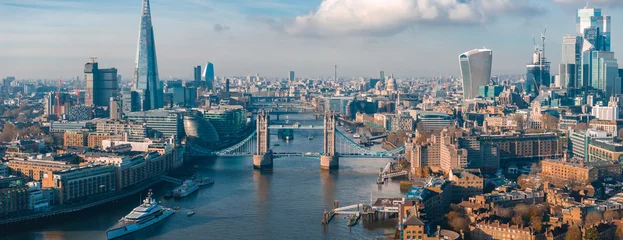 Fotobehang Aerial view of the Iconic Tower Bridge connecting Londong with Southwark on the Thames River in London, UK. © ingusk