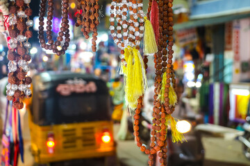 Puttaparthi, India. Indian traditional handicraft (glassbeads) on the street market.