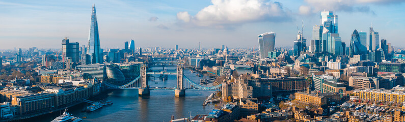Aerial view of the Iconic Tower Bridge connecting Londong with Southwark on the Thames River in London, UK.