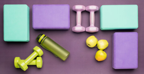lilac background with fitness accessories