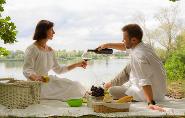 a man and a woman spend time on a picnic