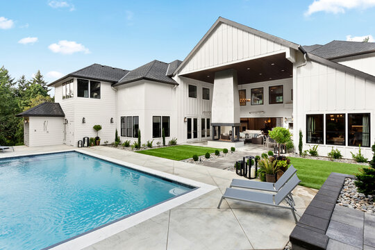Swimming pool in backyard exterior of extraordinary luxury home