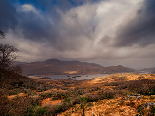 Stunning nature scene with mountains and dark dramatic sky. Ladies view, Killarney, Ireland, ring of Kerry route. Magnificent Irish nature and popular travel and tourist area.