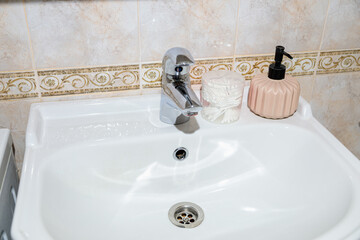 White sink with faucet in the bathroom