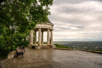 Rotunda Aeolian Harp in Pyatigorsk, Stavropol Krai, Russia. It is landmark of city installed in 1831. Old arbor on Mashuk mount in Caucasian Mountains in summer. Travel, sky, park theme