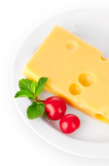 Yellow cheese with red tomatoes and green mint leaves on the white plate. Organic natural food ingredients isolated background. PNG.