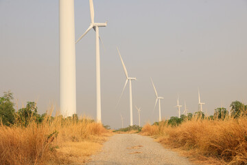Silhouette windmill or Wind Turbine farm against rising sky, Eco green energy, renewable energy