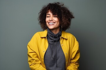 Fototapeta na wymiar Portrait of a smiling african american woman in yellow jacket