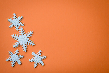 Beautiful winter snowflakes on a plain background with copy space