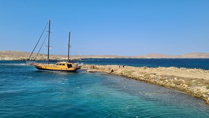 Obraz premium Delos Island, a jewel in the Aegean Sea, holds rich mythological and archaeological significance. 