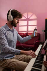 Man Making Remote Music Piano Lesson With Smartphone Live