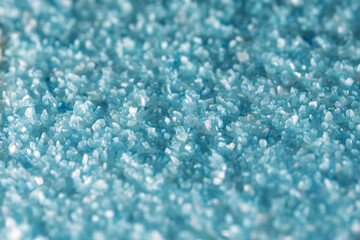 Obraz premium Texture of fine light blue sand crystals close up. Photo for background, with small depth of field