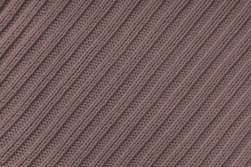 Fototapeta premium Jersey textile background , brown diagonal striped knitted fabric. Woolen knitwear, sweater, pullover surface texture, textile structure, cloth surface, weaving of knitwear material