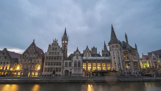 Ghent Belgium, city skyline day to night time lapse at St Michael's Bridge (Sint-Michielsbrug) with Leie River and Korenlei