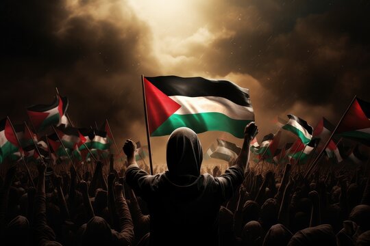 Anonymous man with raised hand holding Palestine flag on the dark cloudy sky background with sunshine. Palestine freedom protest. free Palestine campaign. I stand with Palestine.