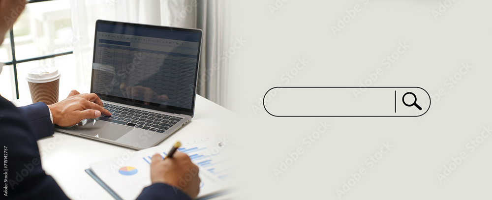 Poster man searching information is typing a keyboard technology search engine optimization on desk in offi