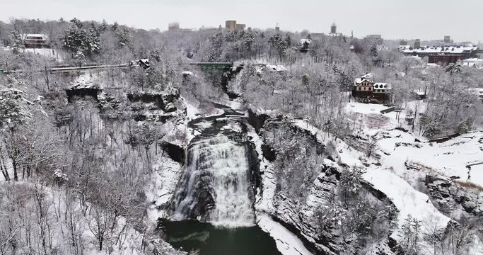 Afternoon winter aerial video of Ithaca Falls on Fall Creek, City of Ithaca, NY, USA 01-14-2024