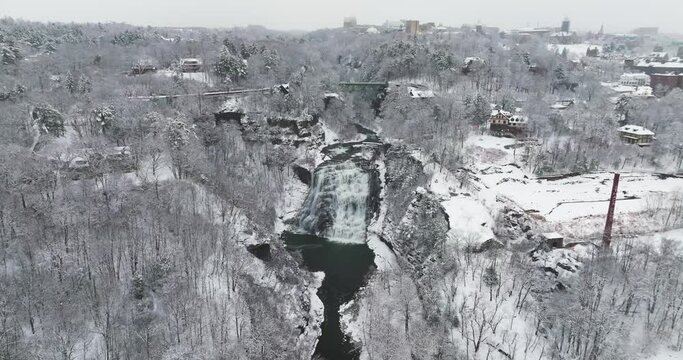 Afternoon winter aerial video of Ithaca Falls on Fall Creek, City of Ithaca, NY, USA 01-14-2024