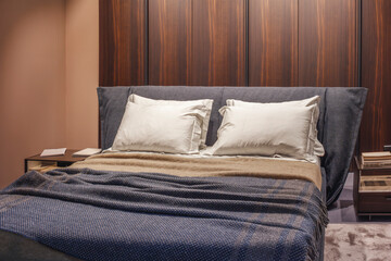 Bedroom interior in brown and blue tones