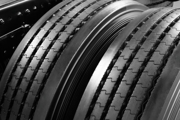 Black car tires in auto store, closeup