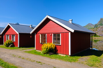 Fototapeta na wymiar Traditional little red Scandinavian Swedish houses, Summer view of a red house Scandinavia Norway, vacation travel concept