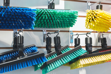 Plastic brushes for cleaning an apartment and office in a rack in a store, cleaning concept...