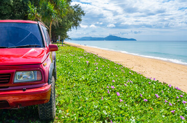 Phuket Thailand 5 December 2023, 4x4 Red car Suzuki Vitara 1993 on the dirt road,Beautiful sea landscape view at sunny sky in Phuket Thailand.