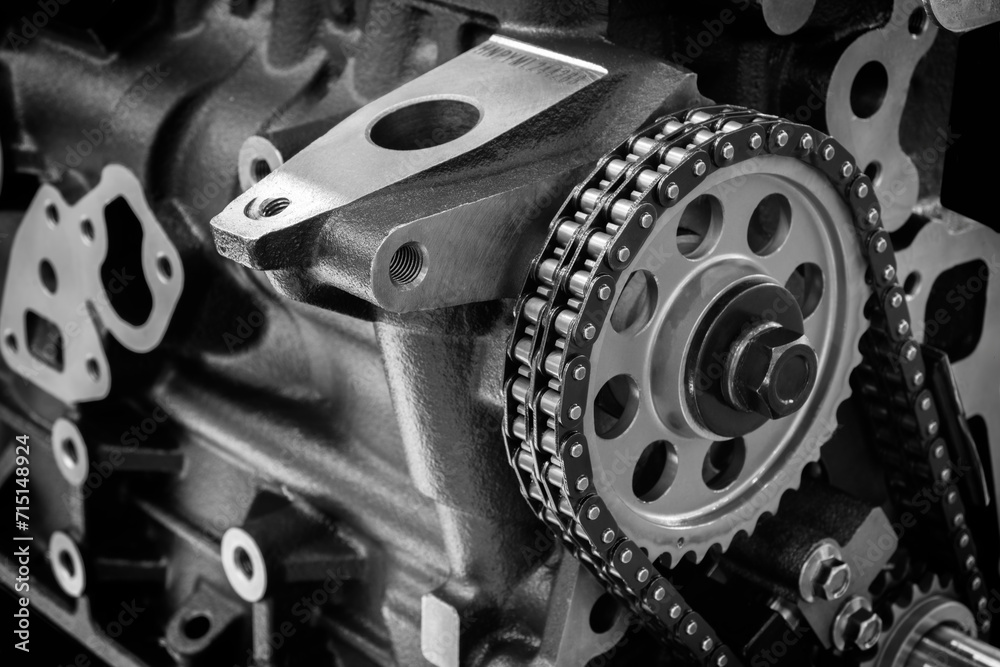 Poster new car timing chain on a disassembled engine in a car workshop. Timing chain in internal combustion engine