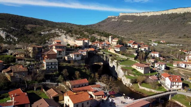 Aerial view of Puentedey, a picturesque village with a natural bridge over the river. Burgos, Spain. High quality 4k footage