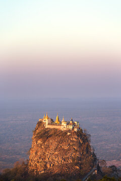 Mount Popa sacred mountain rock at sunrise, Myanmar