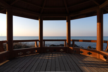 view of the sea seen through a pavilion