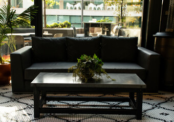 waiting room with sofa in a very tasteful architectural environment